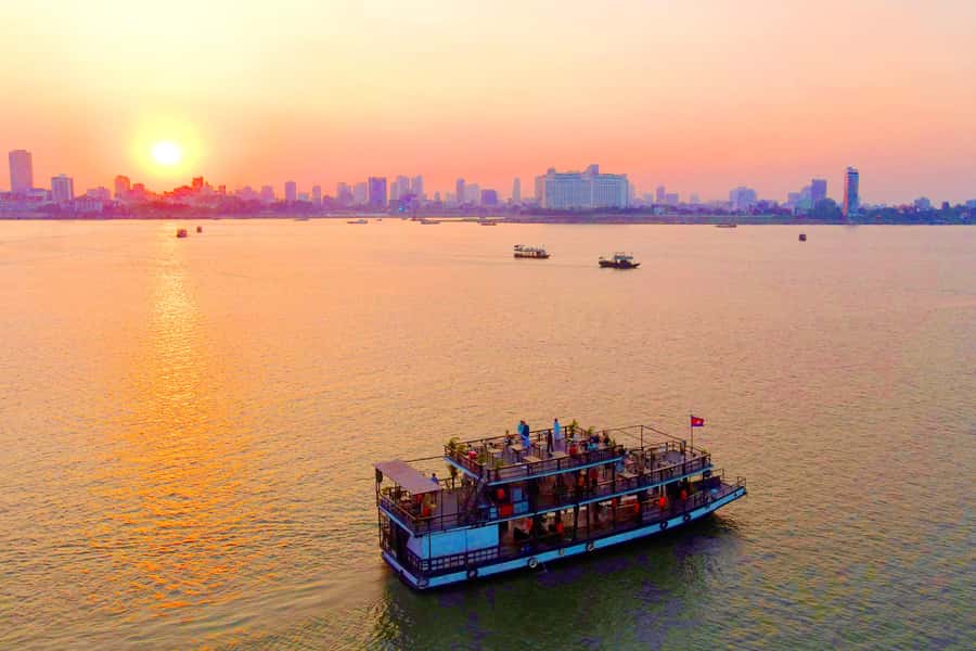 Phnom Penh: Sunset Cruise with Unlimited Beer &Fruit platter - The On-Board Vibe: Unlimited Beer, Soft Drinks, and a Fruit Platter