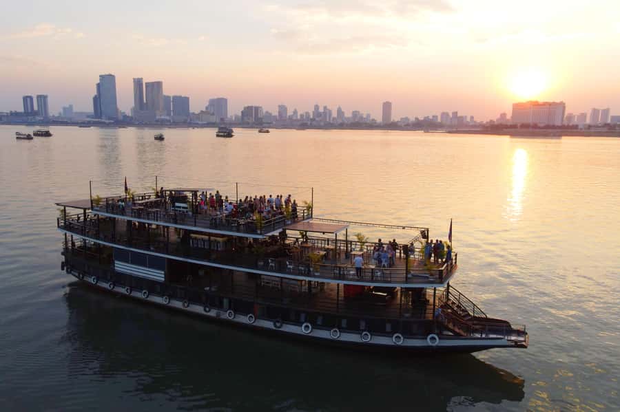 Phnom Penh: Sunset Dinner Cruise with English Speaking Guide - Royal Palace, Hotel Cambodiana, and Diamond Island from the boat